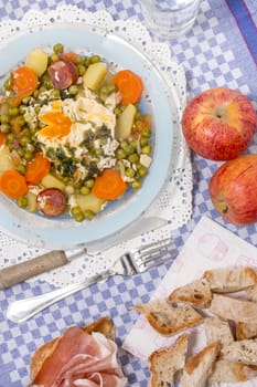 Traditional portuguese culinary meal of green peas with egg, potatoes and carrots.