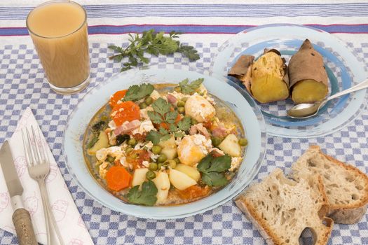 Traditional portuguese culinary meal of green peas with egg, potatoes and carrots.