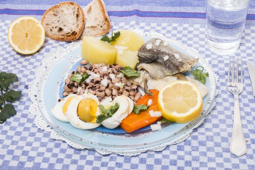 Traditional portuguese meal of cowpeas with cod fish, potato and egg.