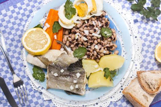 Traditional portuguese meal of cowpeas with cod fish, potato and egg.