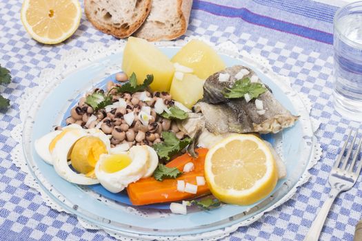 Traditional portuguese meal of cowpeas with cod fish, potato and egg.