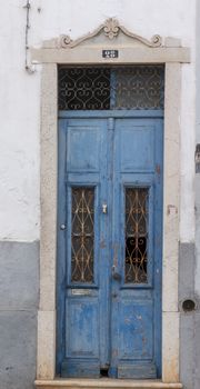 Typical wooden doors of Portuguese architecture in buildings.