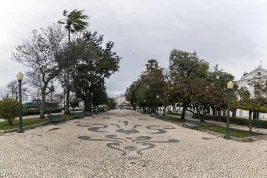View of the Garden Manuel Bivar in Faro city with cobblestone art.