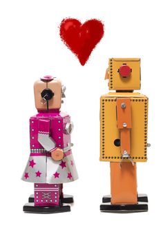 Vintage retro  tin toy robot couple concept isolated on a white background.