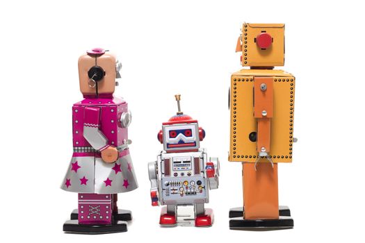 Vintage retro  tin toy robot family concept isolated on a white background.