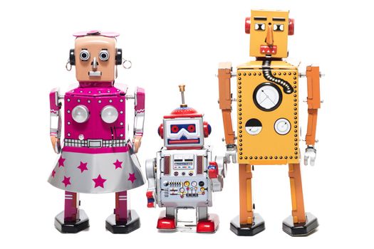 Vintage retro  tin toy robot family concept isolated on a white background.