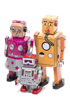 Vintage retro  tin toy robot family concept isolated on a white background.