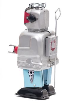 Vintage retro red face tin toy robot isolated on a white background.