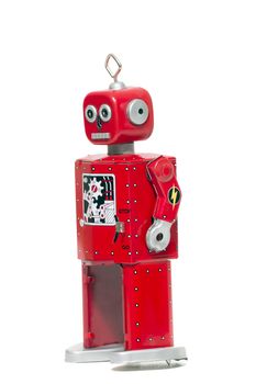 Vintage retro red tin toy robot isolated on a white background.