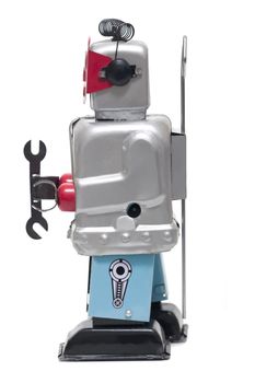 Vintage retro red face tin toy robot isolated on a white background.