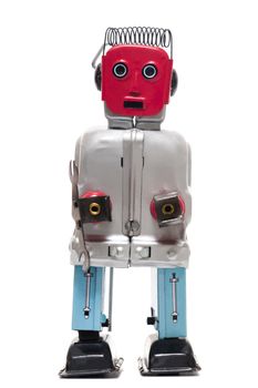 Vintage retro red face tin toy robot isolated on a white background.