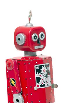 Vintage retro red tin toy robot isolated on a white background.