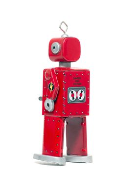 Vintage retro red tin toy robot isolated on a white background.