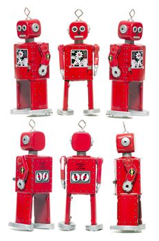 Vintage retro red tin toy robot isolated on a white background.