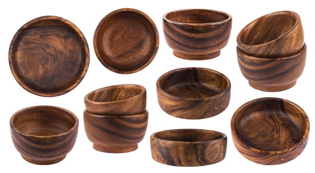 Collection of empty wooden bowls isolated on white background with clipping path.