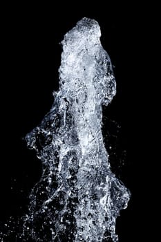 Splash of pouring water isolated over black background