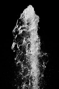 Splash of pouring water isolated over black background