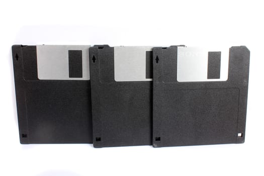 A set of 1.44 MB floppies used for storing data in computers in the 90s.