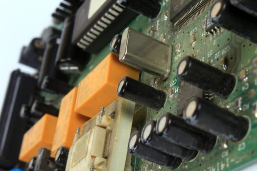 A closeup view of a very old circuit board inside an old internet modem