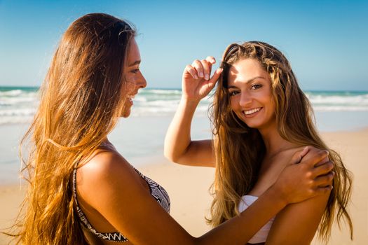 Best friends having fun on the beach 