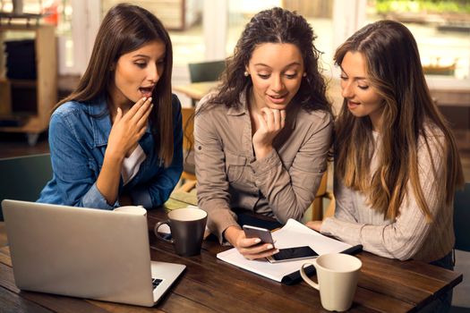 Group of girls making a pause on the studies for some gossip