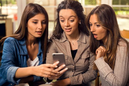 Group of girls making a pause on the studies for some gossip