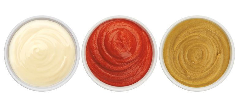 Ketchup, mayonnaise and mustard isolated on white background top view with clipping path