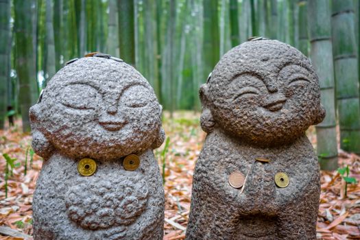 Small Jizo Statues in Arashiyama bamboo forest, Kyoto, Japan