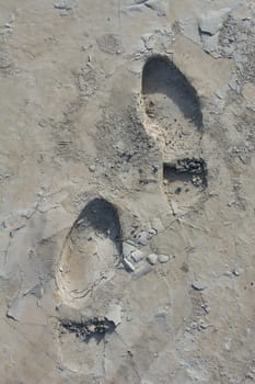 Footstep pattern seen on a concrete background