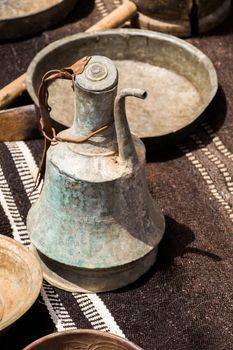 Ancient metal jug in oriental style  in antique market