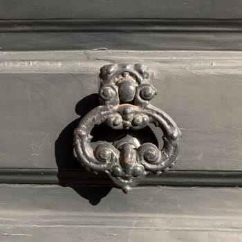 Close up of rustic old door in Florence, Italy.