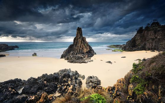 Formidable weather elements, moody storm clouds, rain and strong winds at the Pyramid rock sea stack