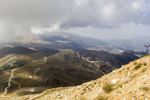 the serpentine road through sunlit mountains. Antalya