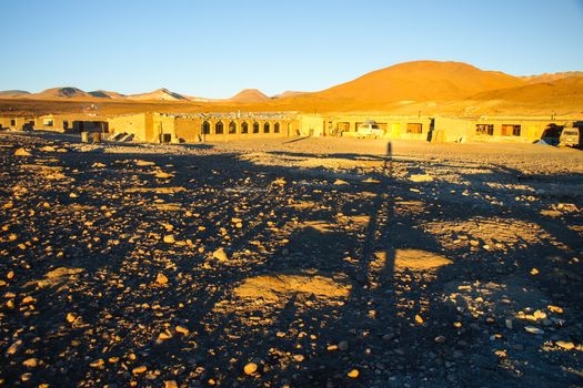 Evening landscape and accomodation buldings at Laguna Colorada, Altiplano area, Bolivia, South America.