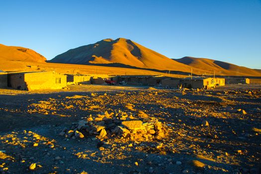 Evening landscape and accomodation buldings at Laguna Colorada, Altiplano area, Bolivia, South America.