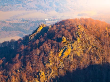 Frydlatske cimburi granite rock formation on the ridge in the middle of beech forest of Jizera Mountains, Czech Republic.