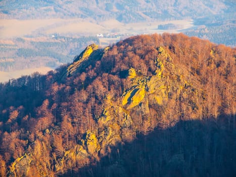 Frydlatske cimburi granite rock formation on the ridge in the middle of beech forest of Jizera Mountains, Czech Republic.