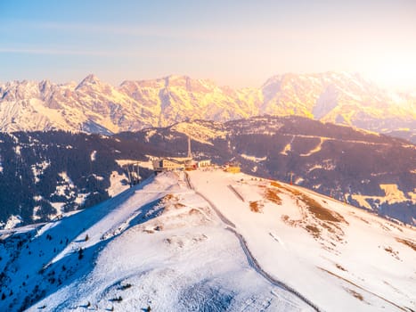 Panoramic view of winter mountains. Alpine peaks covered by snow.