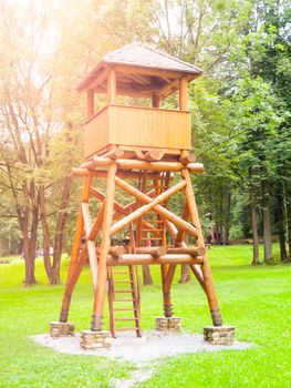 Vintage wooden guard tower in the forest.