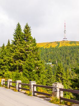 Asphalt road leading to TV transmitter and lookout tower on the summit of Praded Mountain, Hruby Jesenik, Czech Republic.