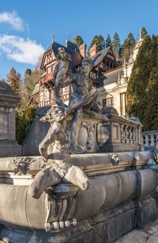 Peleș Castle near Sinaia and the Carpathian Mountains in a sunny day. Transylvania, Romania