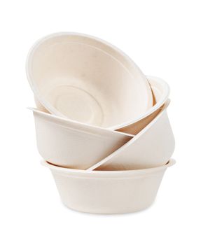 Heap of product made from bagasse for container food, bowl or cup. Isolated on white background, Clipping path.