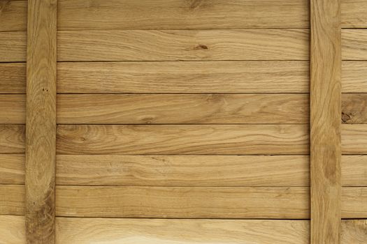 old boards of oak. in the lower left corner is a wooden flower . suitable for background.