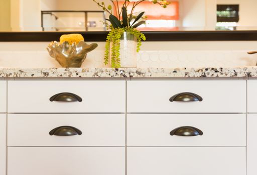 Classic Bathroom Granite Counter Top and Drawers Abstract.