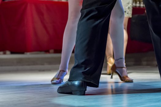 legs of a couple who dance in competition