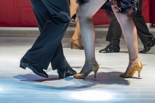 legs of a couple who dance in competition