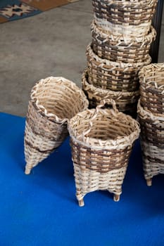 Empty wicker baskets are for sale in a market