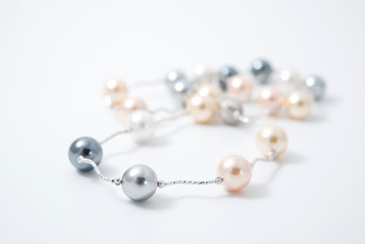 pearl necklace on white background