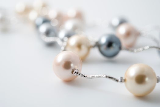 pearl necklace on white background