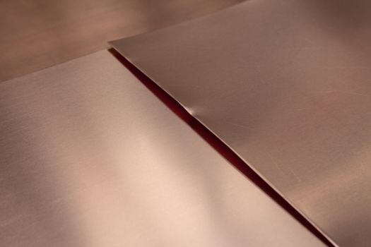 Close-up of copper sheet metal, background with copy space.